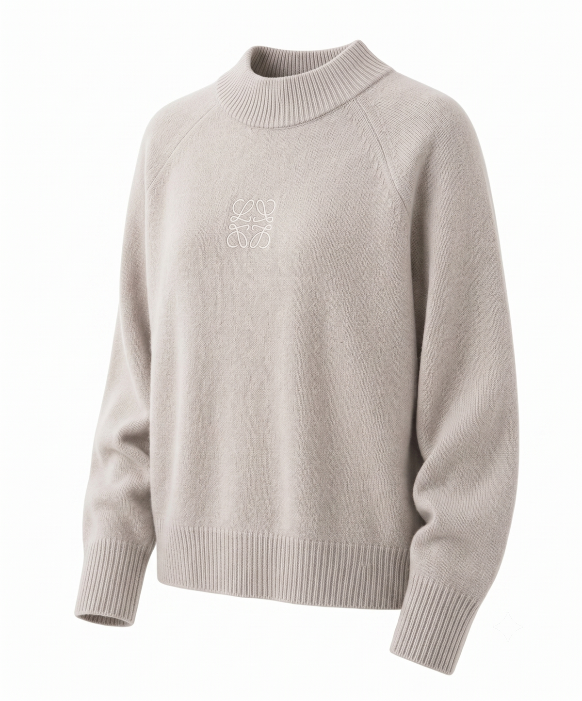 Detail of the cuff and knit grain on a white cashmere jumper