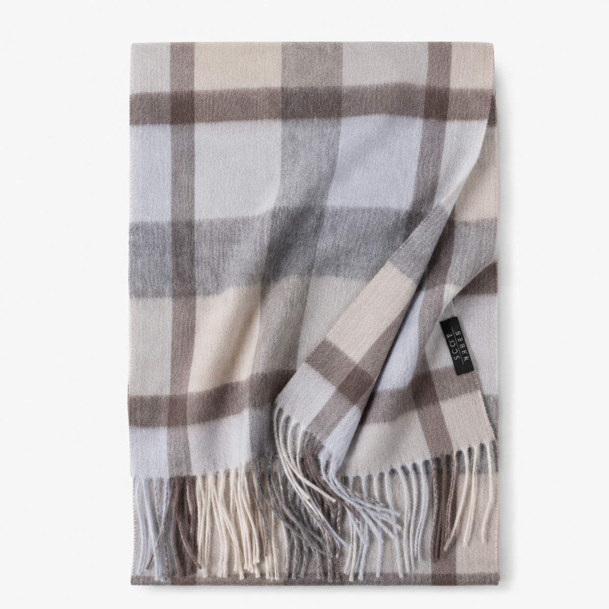 Beige tartan cashmere blanket scarf with fringed edges, shown folded