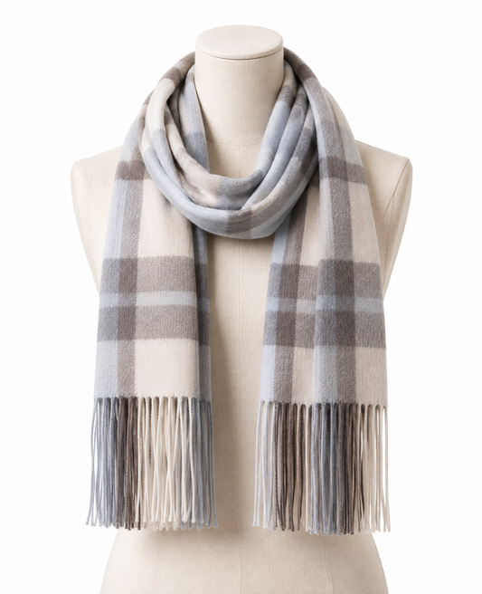 Beige tartan cashmere blanket scarf draped over the shoulders