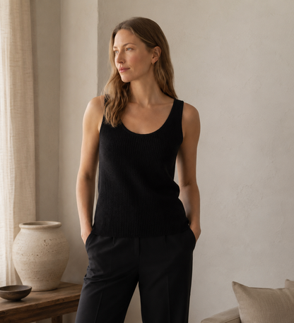 Grey sleeveless cashmere vest styled with tailored trousers