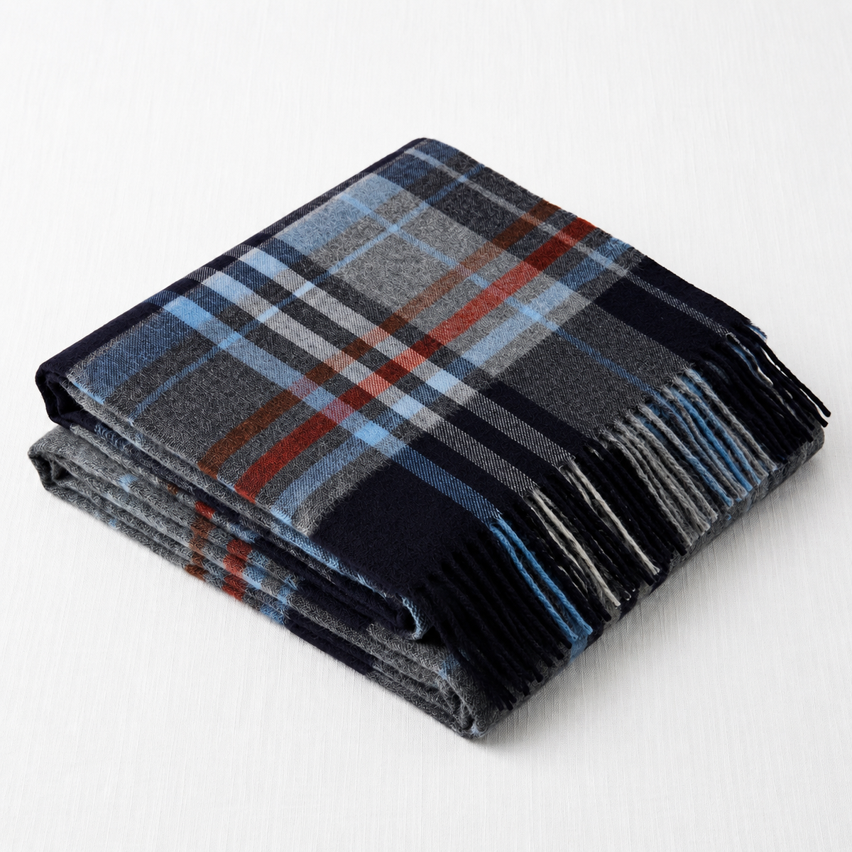 Close-up of the tonal black check weave on a cashmere blanket scarf