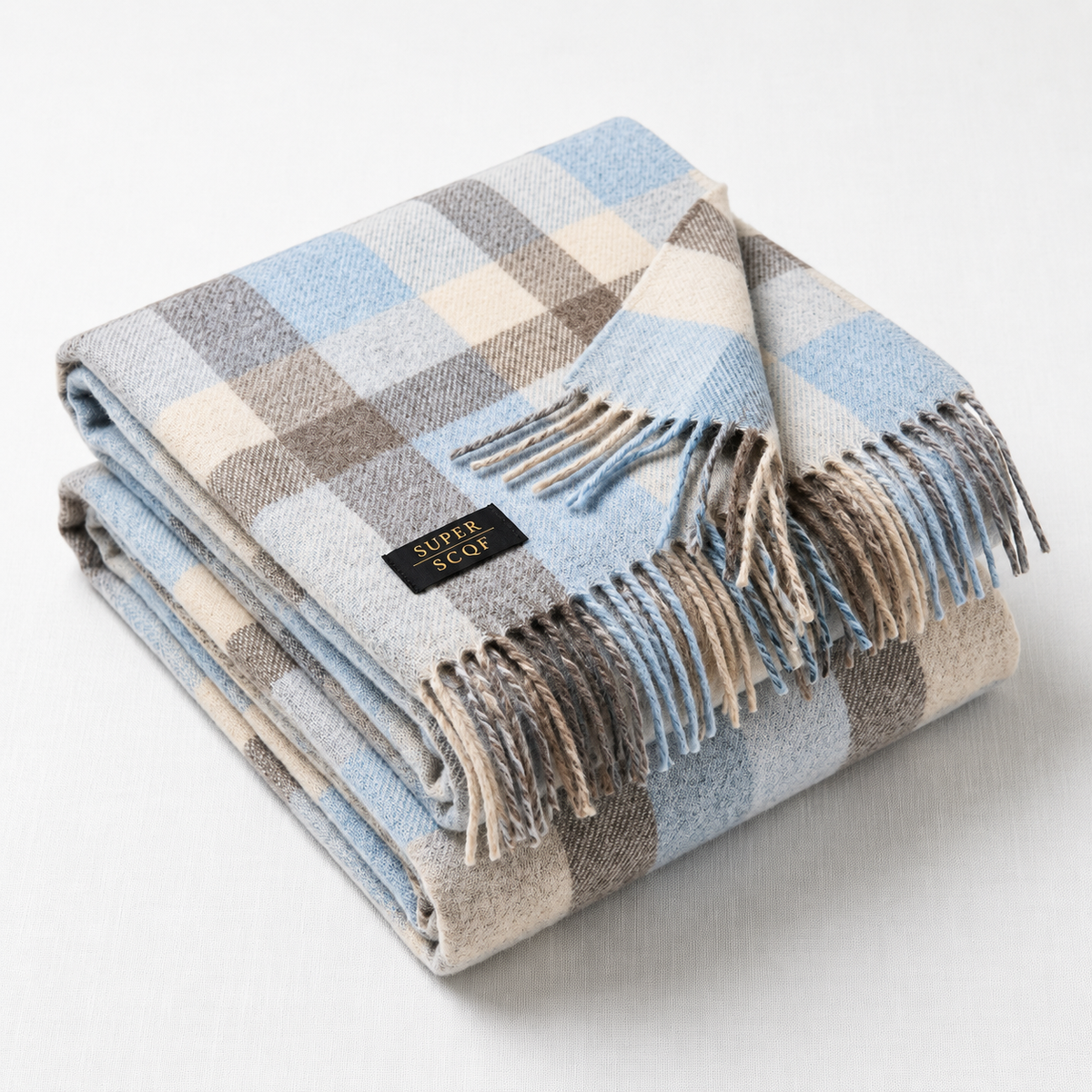 Blue and grey tartan cashmere scarf worn around the neck