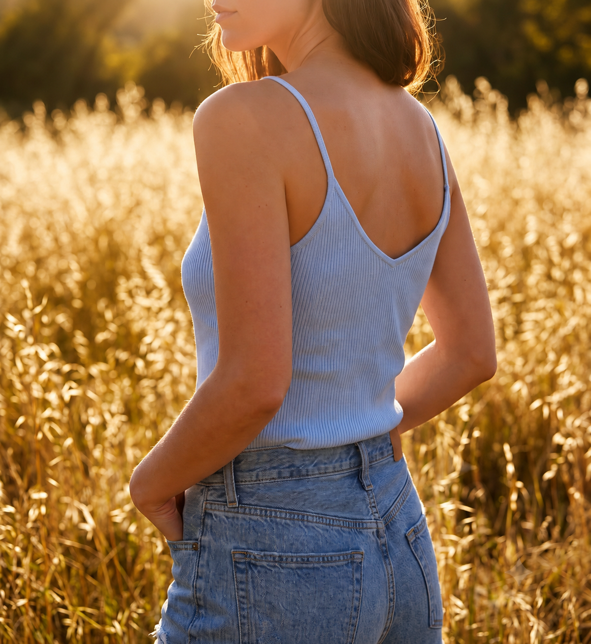 Light blue ribbed cashmere camisole styled under an open knit cardigan