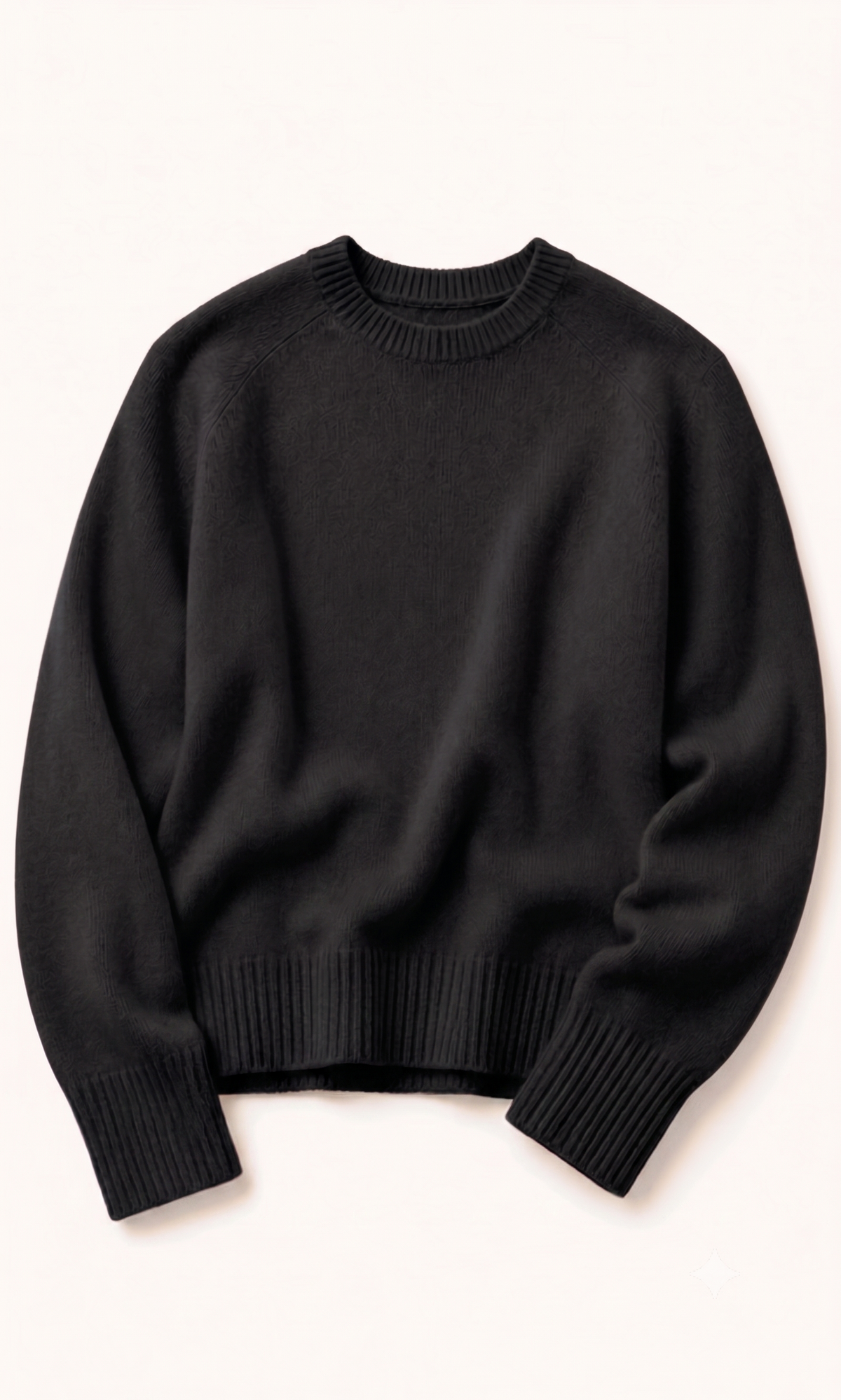 Detail of the cuff and knit grain on a light brown cashmere jumper