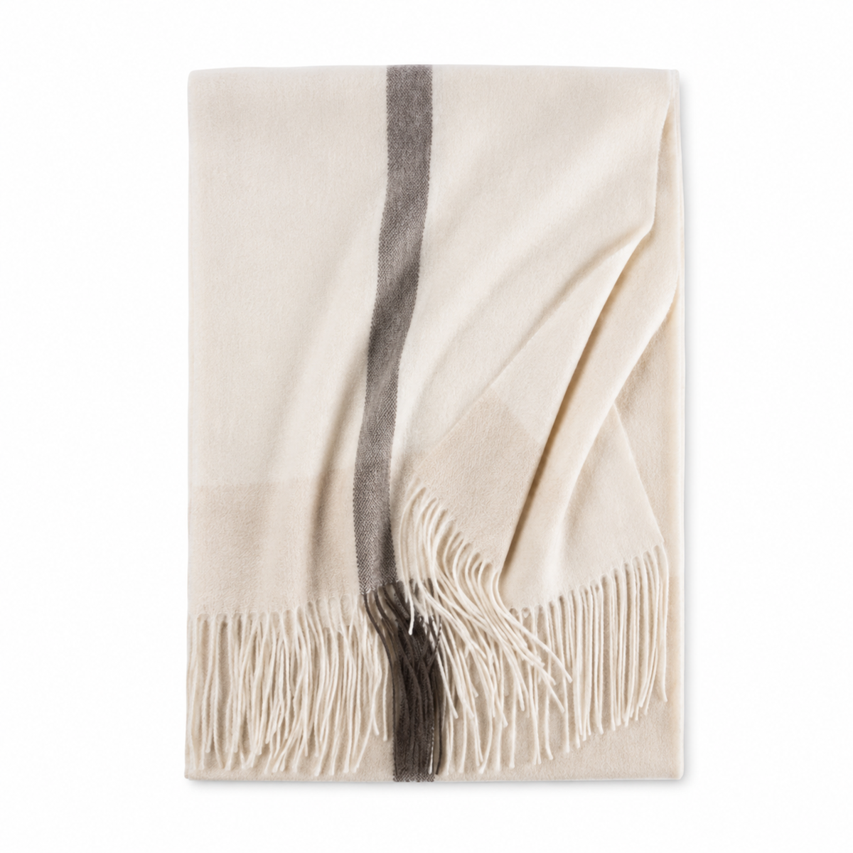 Close-up of the fringed edge on a cream cashmere wrap scarf